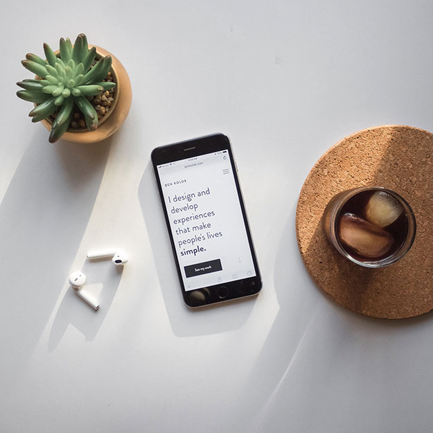 in digital marketing agency in surat attachment details showing a thumbnail of a flat lay with a phone ,coffeecup,plant,and glasses